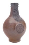 A German salt glazed Bellamine or Bartmann Krug of typical bellied form with embossed mask and