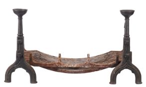 A substantial cast iron dog grate in Gothic taste,