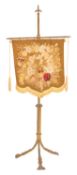 A Victorian brass polescreen, with an adjustable tassel hung banner of floral gros-point needlework,