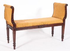 An Edwardian carved mahogany scroll end window seat, with husk and paterae decoration,