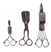 A 19th Century patent steel wick trimmer and snuffer, on three pear-shaped feet,