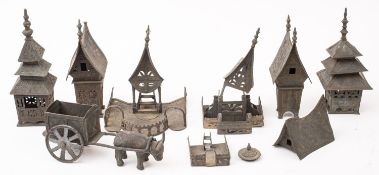A group of Thai/Burmese pierced and engraved metal buildings and a bullock cart.