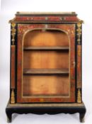 A boullework, ebonised wood and glazed pier cabinet.