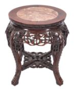 A Chinese carved hardwood and polished stone inset stand,