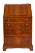 A 19th Century walnut bureau, of small size, with cross and feather banding,