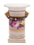 An early 19th century English porcelain spill vase with gilt eagle head ring handles,