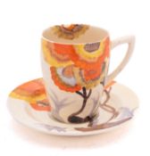 A Clarice Cliff Bizarre cup and saucer decorated in the 'Rhodanthe' pattern, printed marks,