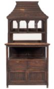 An oak dresser in Arts & Crafts style, circa 1900; the pagoda canopy top modelled resembling slates,