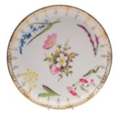 A Swansea plate of 'Paris fluted' shape painted by William Pollard with a central pink and white