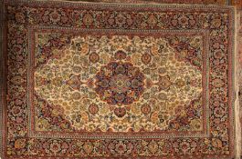 A machine made carpet of Persian pattern,