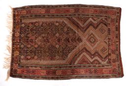 A Qashgai Kelim, the pointed and hooked field in muted shades of brown, rose and ivory,