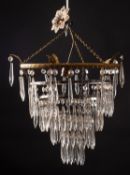 A group of four faceted pendant glass hung metal ceiling lights,