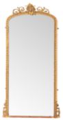 A Victorian giltwood and composition framed pier mirror, in Rococo Revival taste,