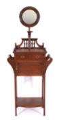 An Edwardian walnut shaving stand,