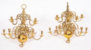 A matched pair of brass twelve light chandeliers in Anglo-Dutch early 18th century style,