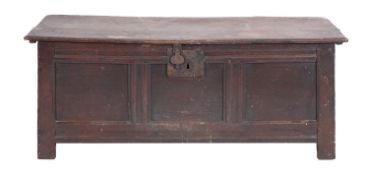 An early 18th Century oak rectangular coffer, with a plain hinged top and triple panel front,