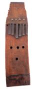 An unusual antique African curved wood kalimbra, with six metal keys, 29cm x 8cm.