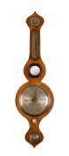 An oak five-dial wheel barometer the eight-inch silvered dial with usual barometer markings,