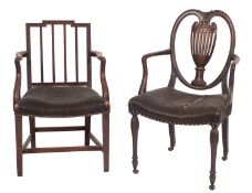 A George III mahogany and upholstered library elbow chair,