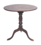 An early 19th Century oak circular occasional table,