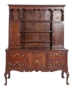 A George III oak and crossbanded dresser,
