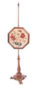 A George IV rosewood and embroidered pole screen,