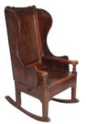An 18th Century pine and fruitwood lambing armchair,
