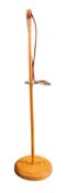 A turned wood and brass adjustable air operated hem measurer,