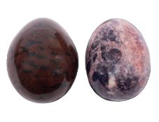 Two coloured hardstone egg-shaped hand coolers.