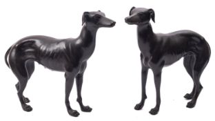Two modern patinated metal models of greyhounds, late 20th century; naturalistically portrayed,