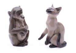 A Royal Copenhagen figure of a seated ape together with a Bing & Grondahl figure of a seated