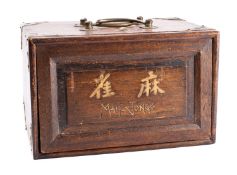 An early 20th century Mah Jong set with five drawers fully fitted with bone and bamboo tiles and