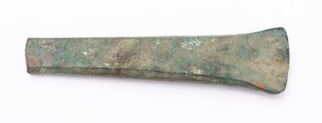 A copper axe head, probably early Bronze Age, circa 1700 BC; solid formed and with flared blade,
