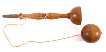A 19th Century treen cup and ball game, with turned twin baluster stem.