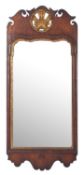 A walnut and parcel gilt framed wall mirror in George I style,