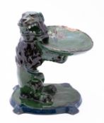 A C H Brannam [Barnstaple] pottery tazza modelled as lion rampant supporting a shallow dish with