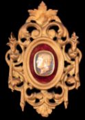 A carved hardstone and yellow metal mounted cameo profile of a Roman Emperor,
