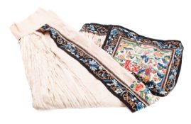A Chinese cream silk pleated skirt embroidered with butterflies,