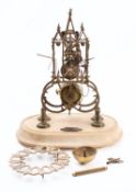 An English brass skeleton clock having an eight-day duration,
