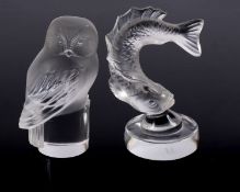 Two Lalique frosted and clear glass paperweights in the form of a barn owl and a leaping fish,