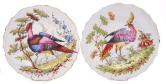 A pair of French pottery plates in the Chelsea style with basket pattern rims,