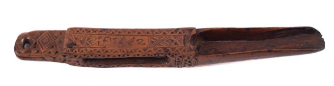 A Charles II fruitwood apple corer, with geometric decoration, initialled B. S. and dated 1662, 16.