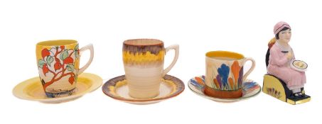 A Kevin Francis 1993 Promotional Release figure of Clarice Cliff together with two Clarice Cliff