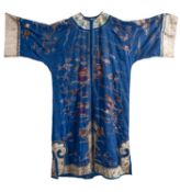 A Chinese silk blue-ground robe and a pair of slippers embroidered overall with pavilions, birds,