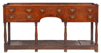 A late 18th Century oak dresser base, with a ledge gallery (formerly with a shelved superstructure),
