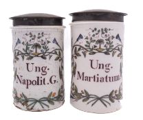 A pair of Italian polychrome maiolica alborelli of cylindrical form inscribed 'Ung.Napolit.G.