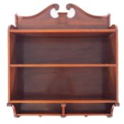 An Edwardian satinwood and mahogany three tier hanging bookcase,