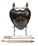 A copper and wrought iron mounted firescreen in Arts & Crafts style,