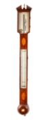 A Georgian mahogany stick barometer the silvered dial engraved with barometric markings,