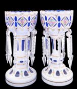 A pair of Bohemian blue and white overlay glass lustres gilded and painted with flowers and foliage,